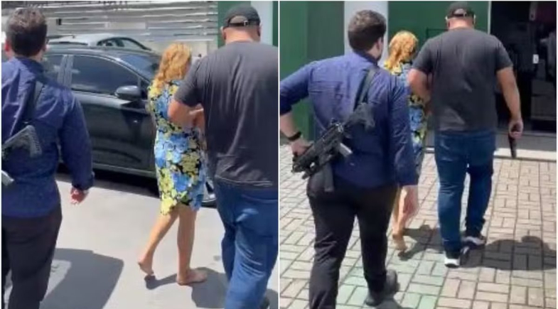 Suspeita é levada à delegacia | Reprodução