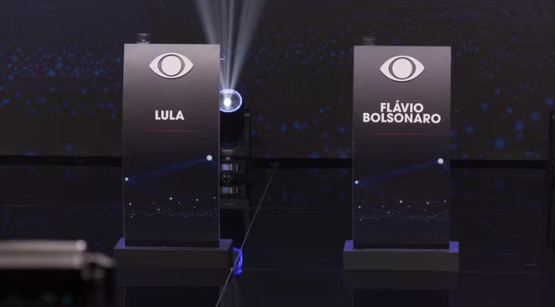 Flávio Bolsonaro diz que vai ao debate da Band após Lula anunciar presença | Divulgação/Band